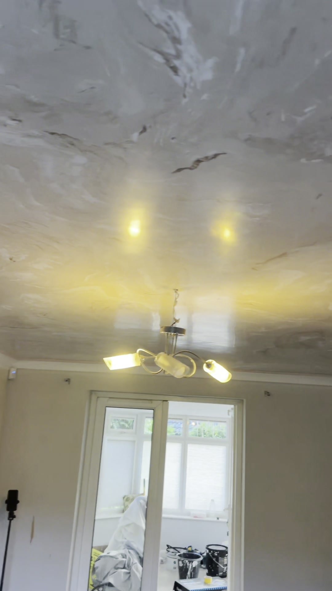 Glossy polished plaster ceiling with pendant lighting