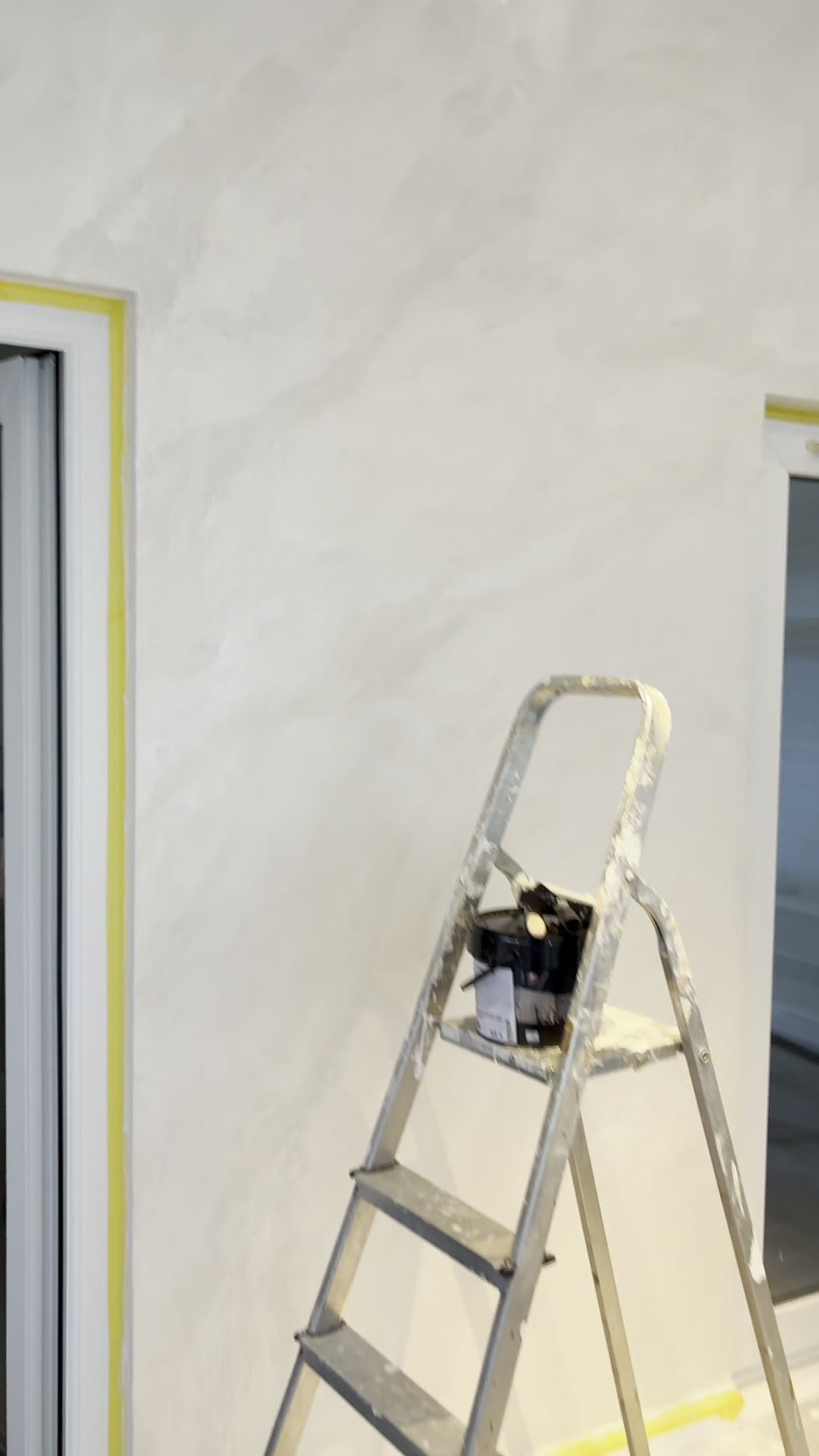 Finished plaster wall in a renovated gable-end room